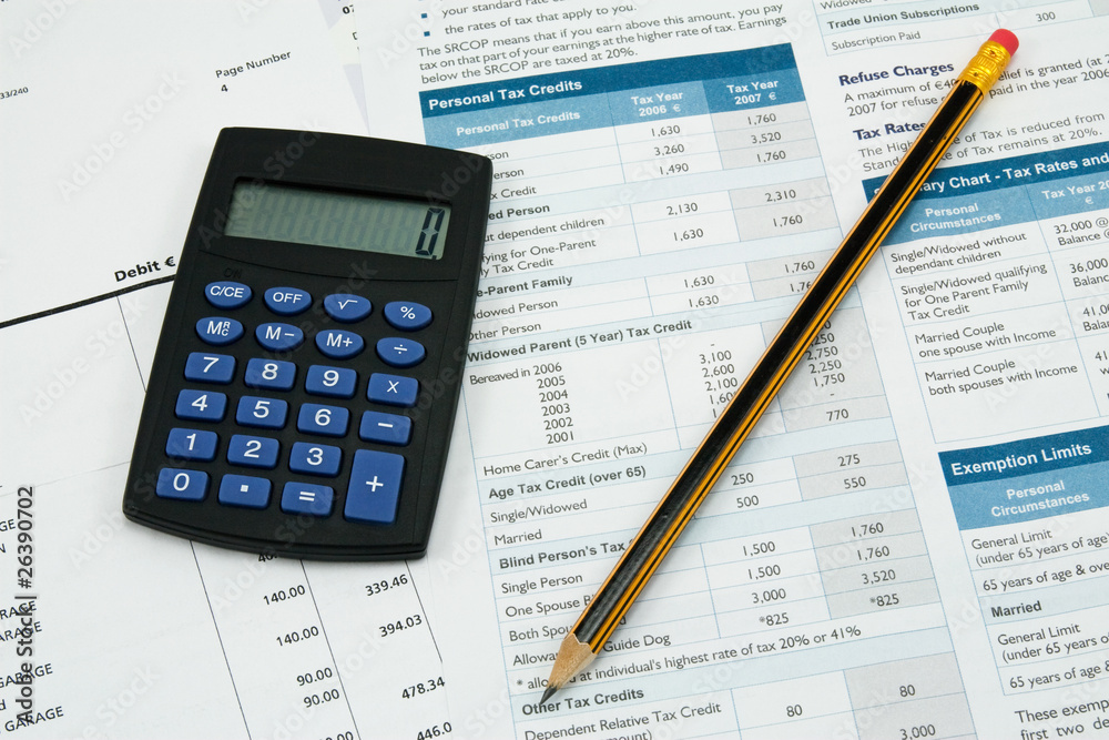financial accounting. calculator,pencil and tax form financial accounting. calculator,pencil and tax form