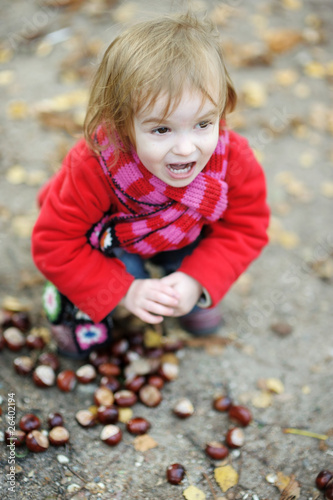 Adorable toddler girl outdoors on autumn day