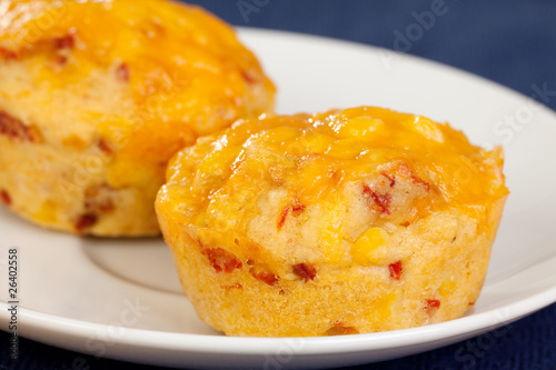 Freshly baked cornbread muffins with cheddar cheese