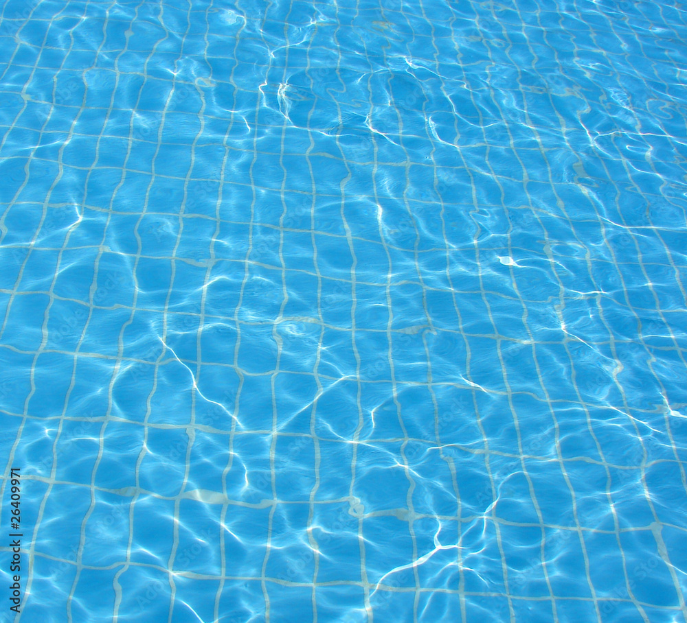 bottom and water in blue transparent pool