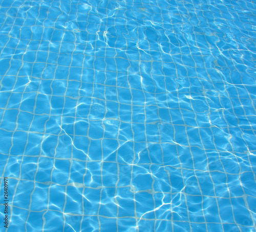 bottom and water in blue transparent pool