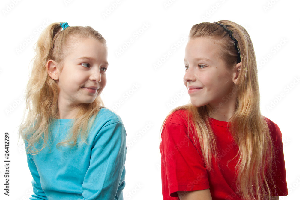 Two blonde girls over white background Two blonde girls over white background