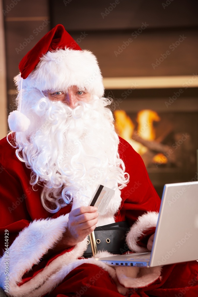 © nyul - Santa Claus paying with credit card