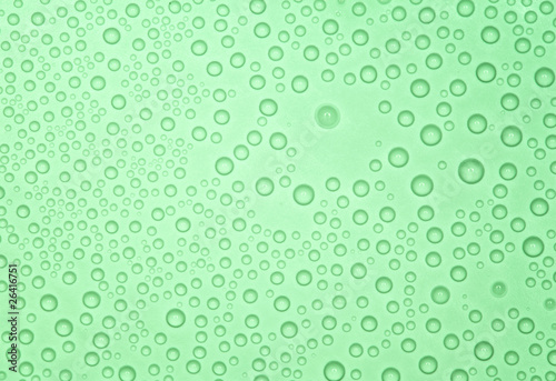 Abstract green background with many water bubbles.