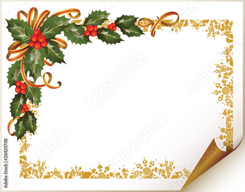 Christmas holly branch in the corner of the paper
