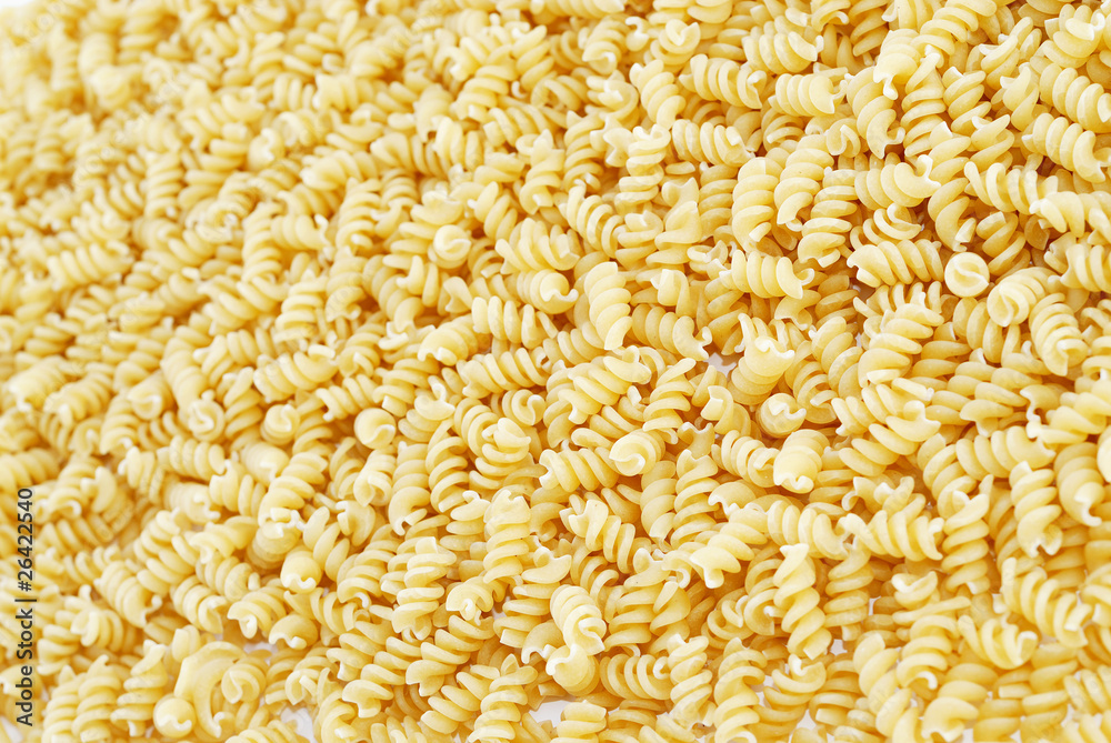 Close-up of italian pasta - spiral shaped, for backgrounds or te Close-up of italian pasta - spiral shaped, for backgrounds or te