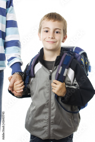 Adorable young boy going to school with his father