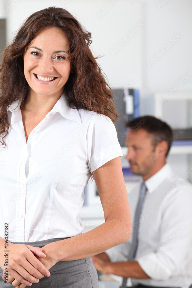 Beautiful woman standing in the office Beautiful woman standing in the office