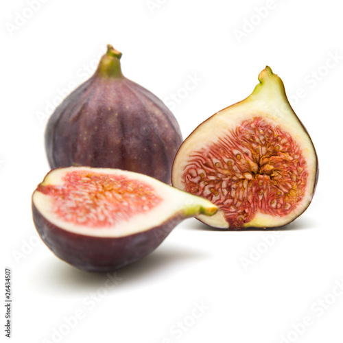 ripe purple fig fruits, one cut in half; isolated;
