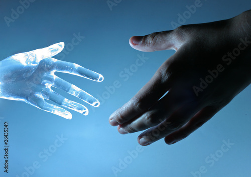 Fényképezés Human hand touch an atrifical glass hand