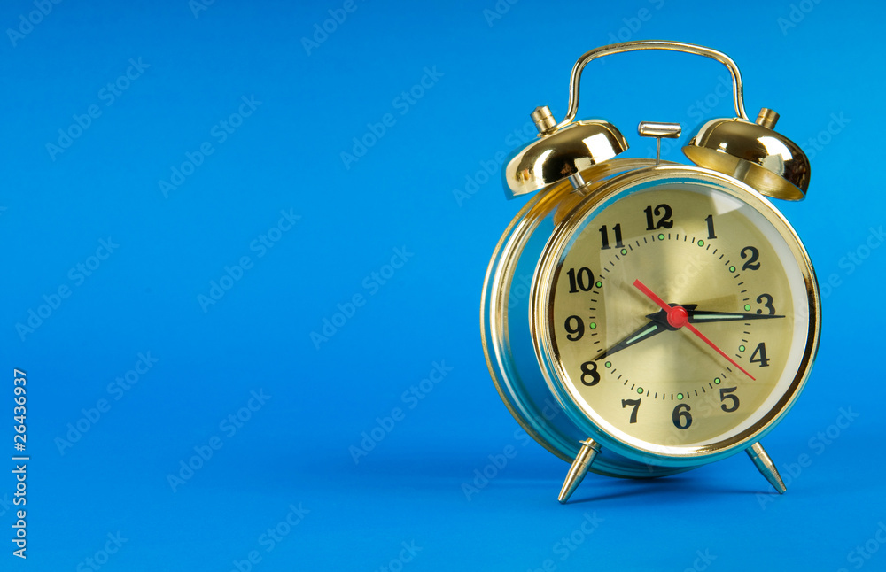 Time concept - alarm clock against colorful background Time concept - alarm clock against colorful background