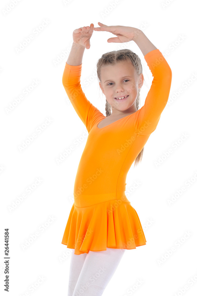 Little beautiful ballerina dancing in an orange dress. Little beautiful ballerina dancing in an orange dress.