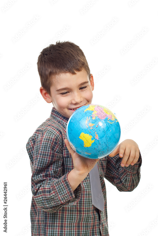 Preschool boy playing with a globe Preschool boy playing with a globe