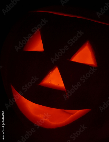 Jack-o-lantern glowing on black background