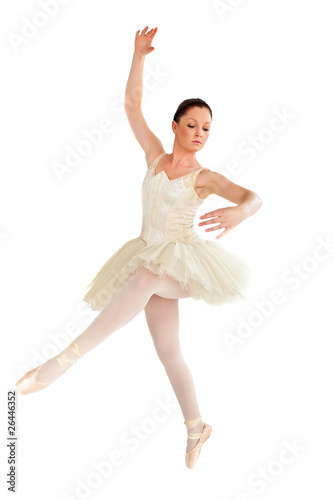 Young ballet dancer dancing against a white background