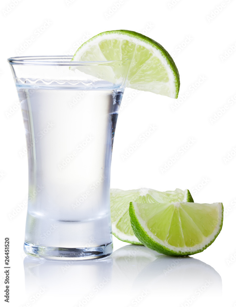 shot glass filled with clear cold alcohol shot glass filled with clear cold alcohol