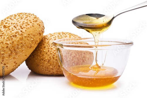 bun with sesame seeds and honey