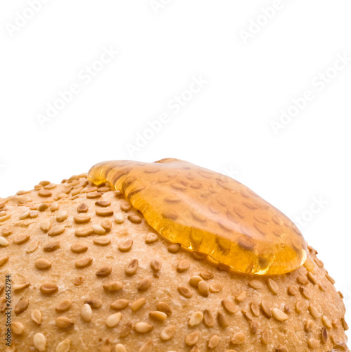 bun with sesame seeds and honey