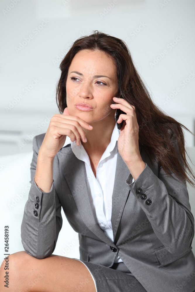 Closeup of businesswoman talking on mobile phone Closeup of businesswoman talking on mobile phone