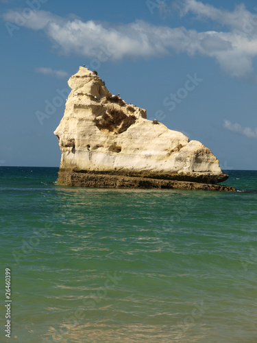 Cliffs at the Algarve coast in Portugal photo