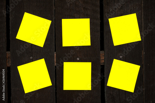 Sticky notes on a wooden wall