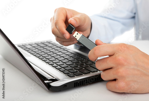 USB flash drive in the men's hands