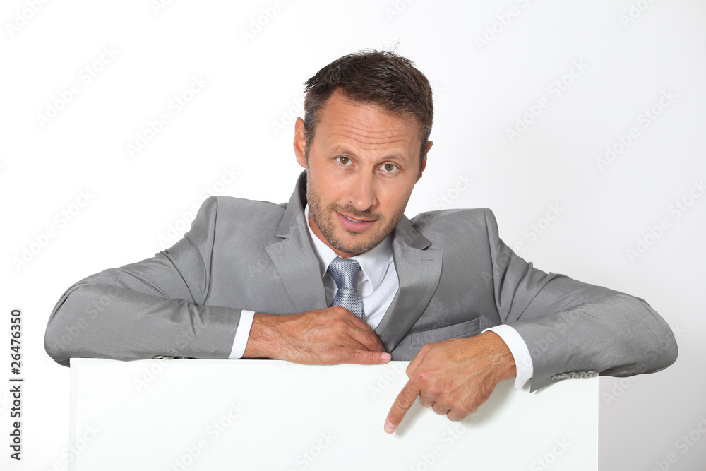 Businessman showing message board