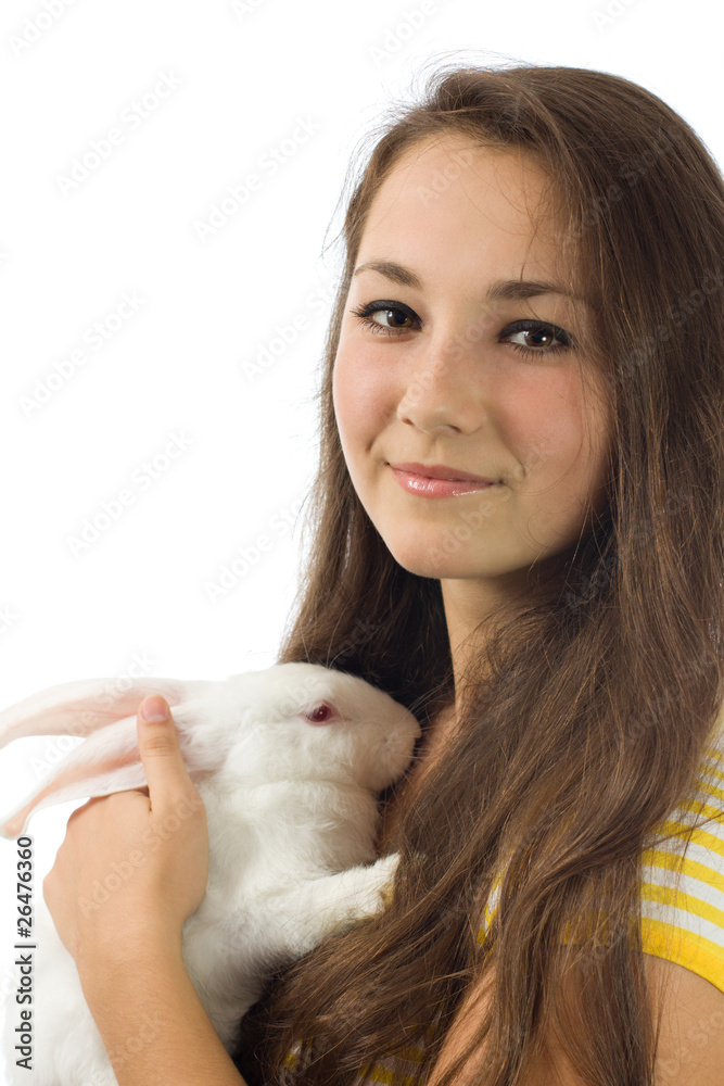 The beautiful girl with a white rabbit