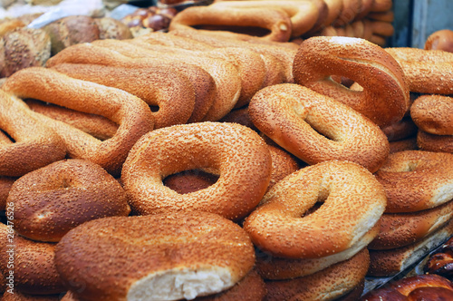 loafs of bagels on market stand