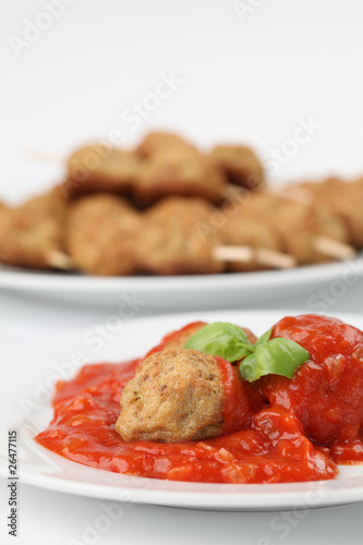 Roast meatballs with tomato sauce. Shallow DOF