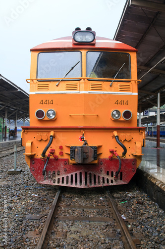Closeup of Yellow diesel train locomotive on Platform.