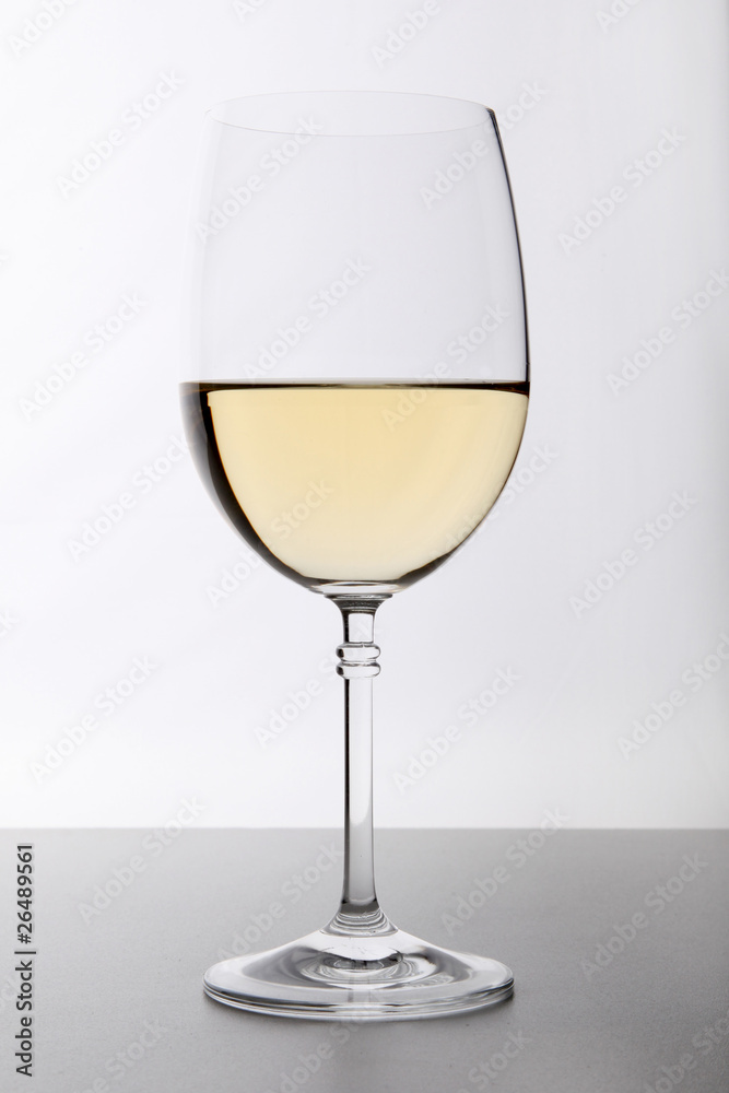 Closeup of glasses full of wine on grey background