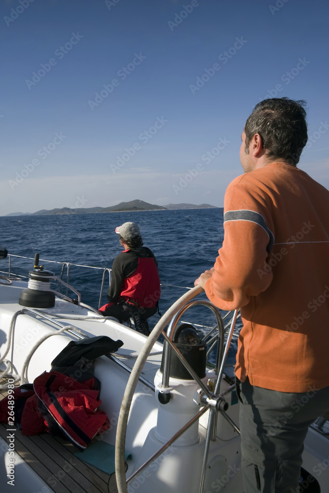 Fototapeta premium the skipper of a yacht still flying