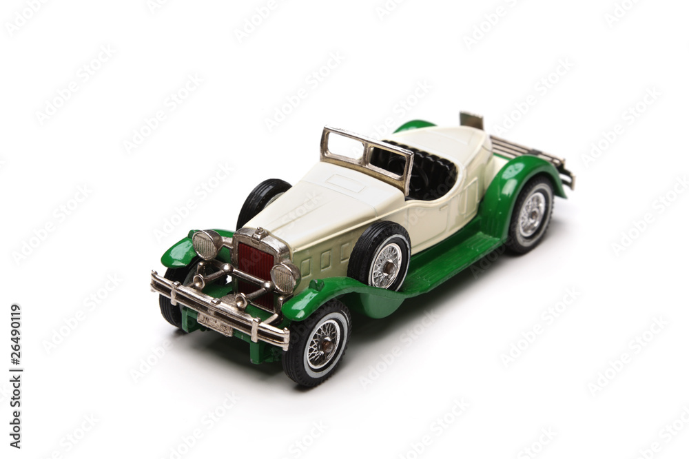 Old toy car isolated on a white background. Old toy car isolated on a white background.