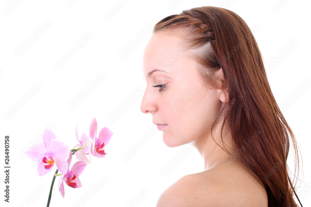 young healthy red-haired woman with pink orchid young healthy red-haired woman with pink orchid
