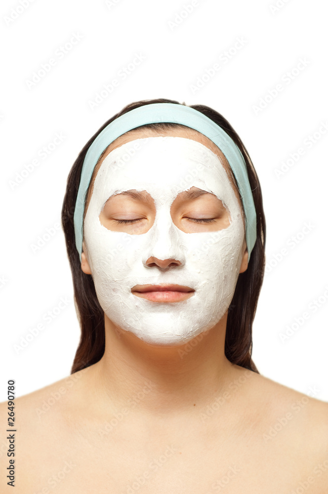 portrait of a young woman with beauty mask on her face isolated