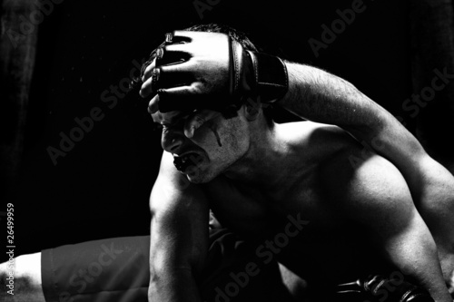 Mixed martial artists fighting - ground fighting photo