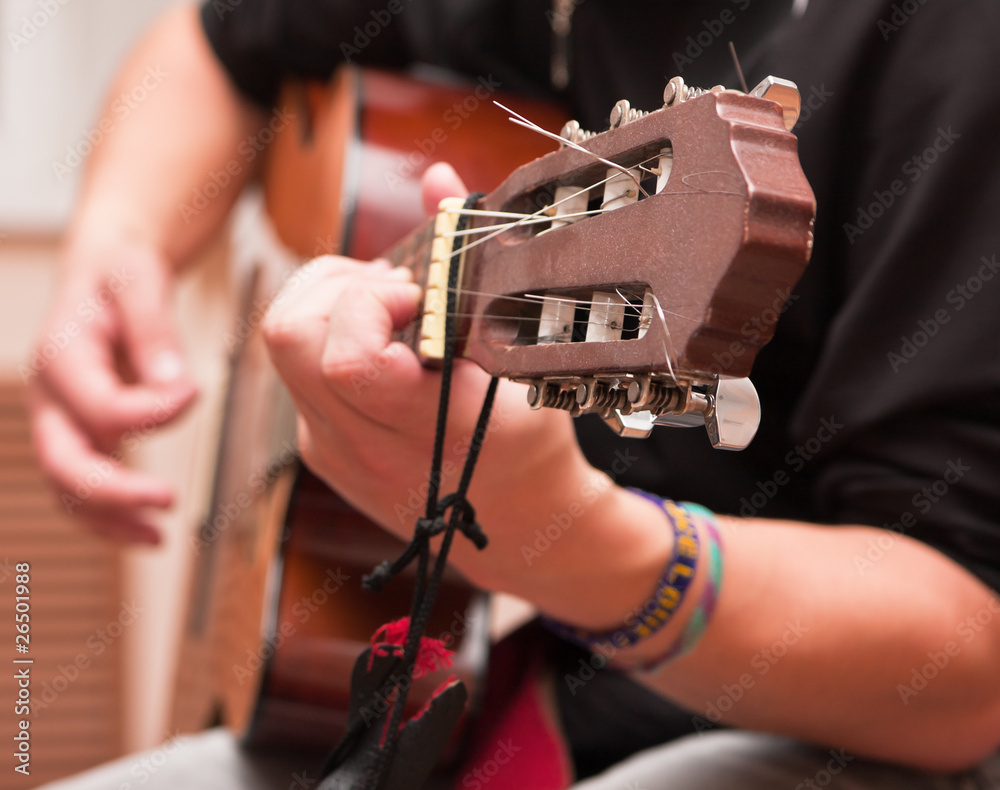 Naklejka premium Man playing an accoustic guitar