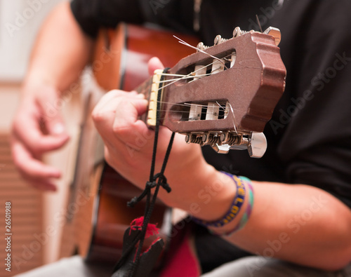 Man playing an accoustic guitar
