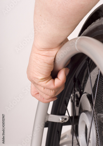 human hand on wheelchair