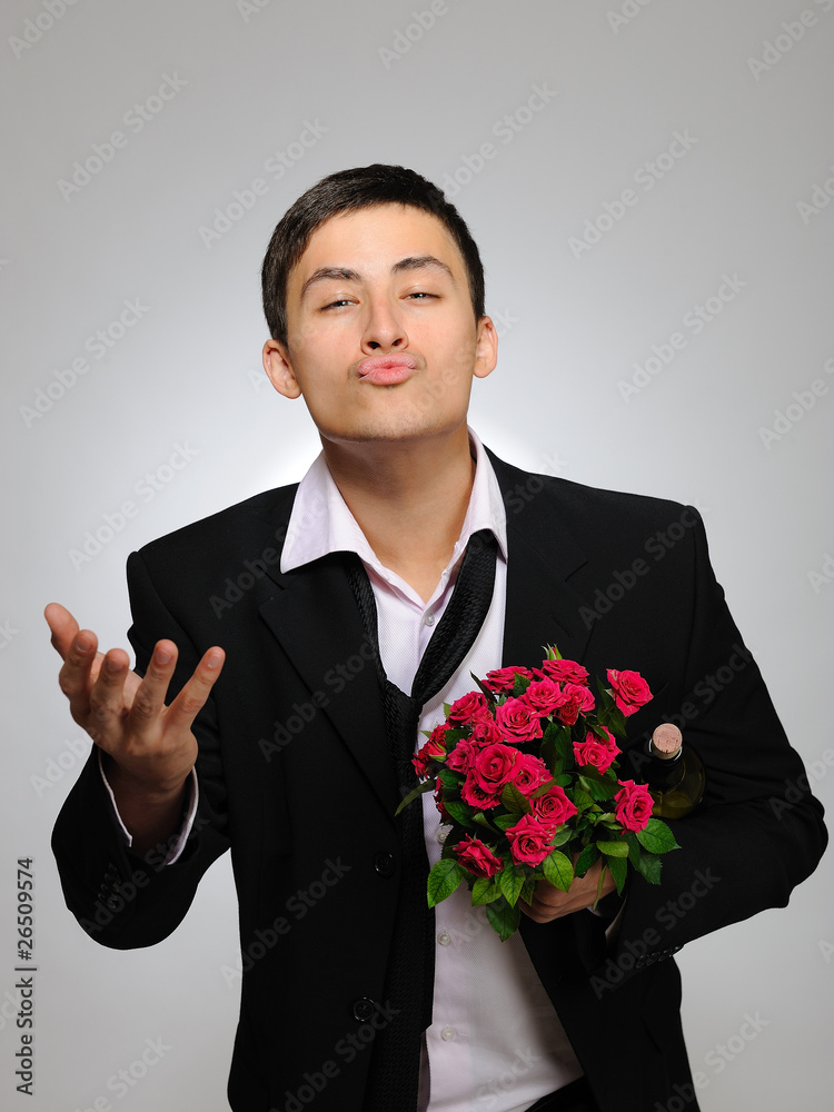 Happy romantic husband holding rose flower and vine bottle prepa Happy romantic husband holding rose flower and vine bottle prepa