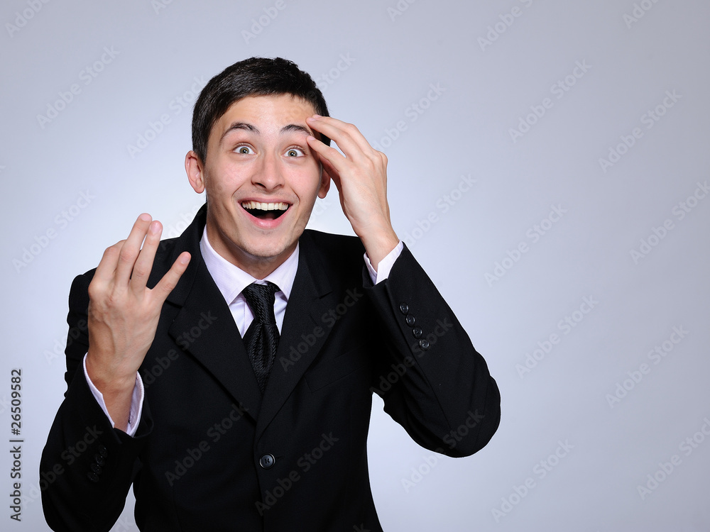 expressions - young happy business man looking up. copy space expressions - young happy business man looking up. copy space