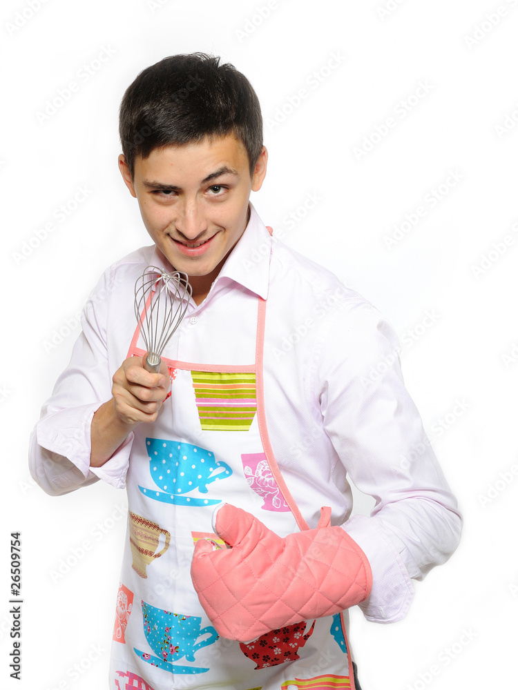 Young happy cook man in apron smiling, holding tool for baking. Young happy cook man in apron smiling, holding tool for baking.