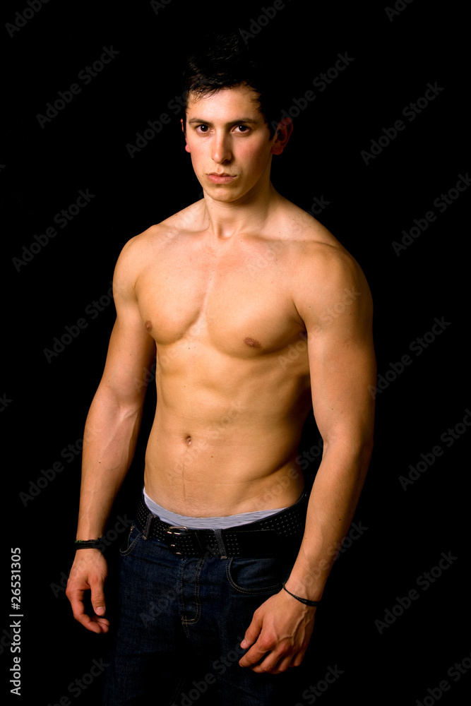 Young man with atletic body on black background Young man with atletic body on black background