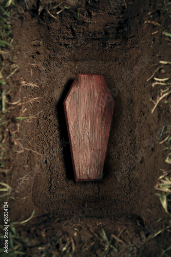 coffin or tomb at graveyard photo