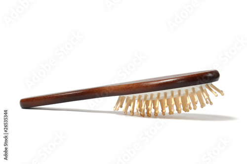 Wooden hairbrush isolated on white background