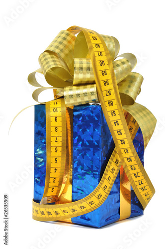 Blue gift and measure tape over white