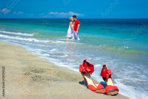 Young attractive couple at the beach kissing