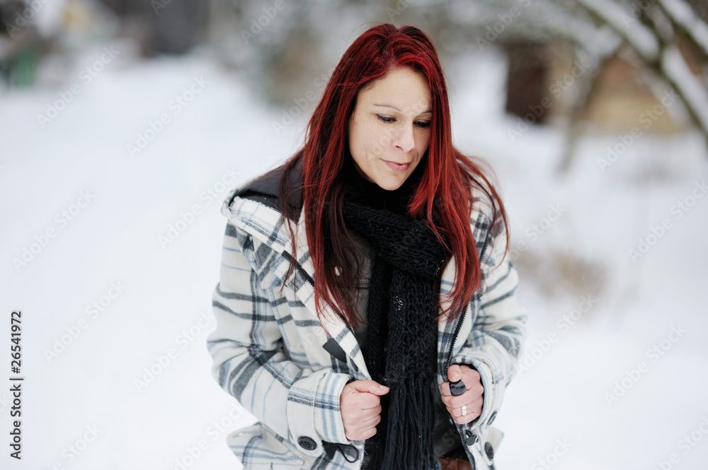 Young woman having a walk in winter forest Young woman having a walk in winter forest