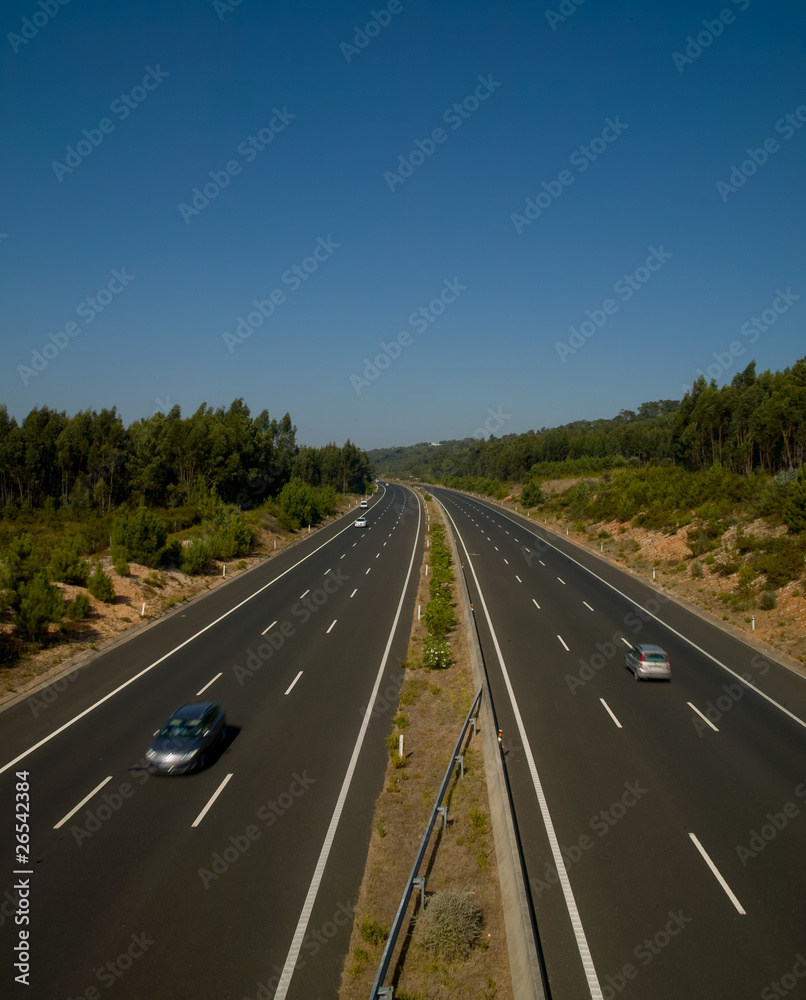 view of highway asphalt with traffic